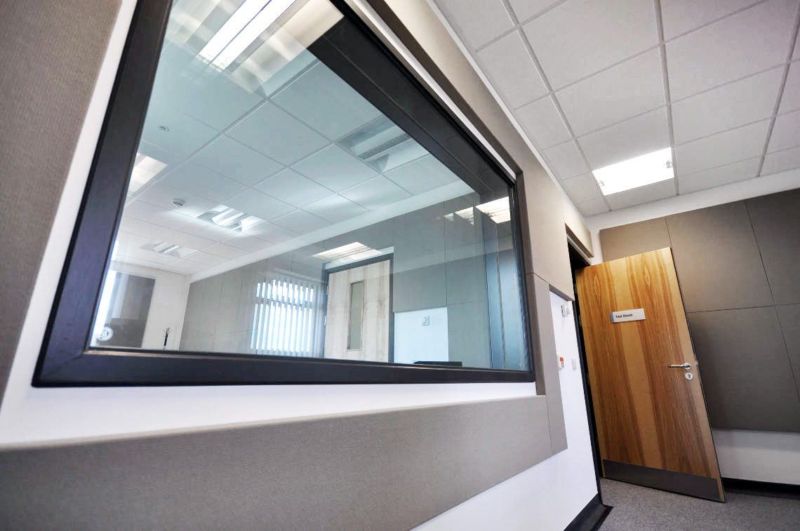 large soundproof window in double wall audiometric sound room